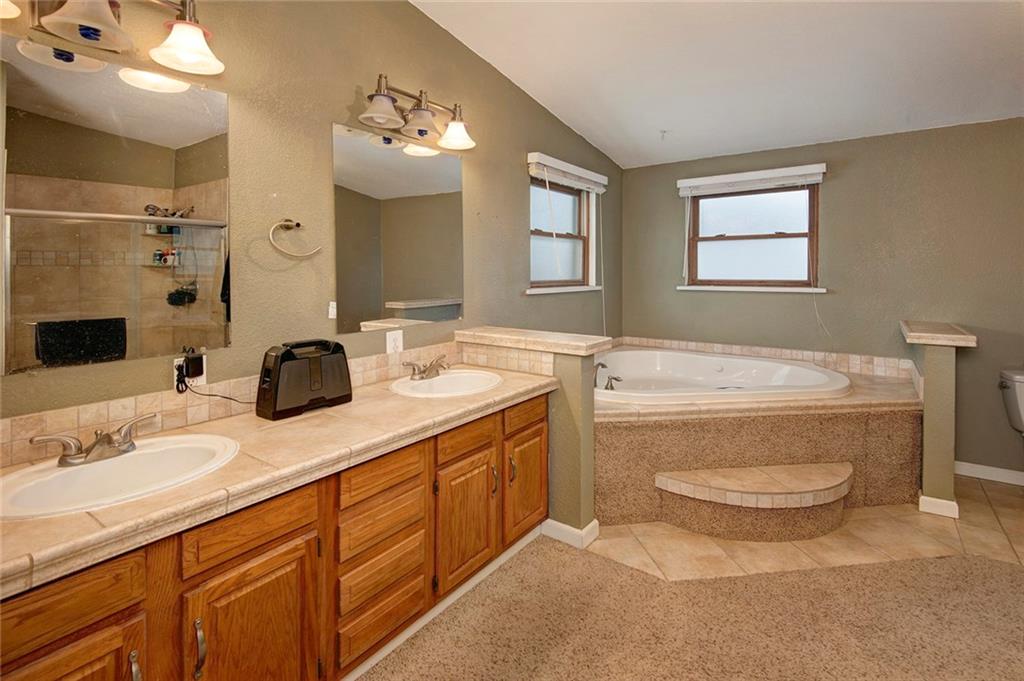 76 Lakeside Drive Dillon, CO 80435 - Photo 15 of 23 a bathroom with a granite countertop toilet sink and mirror