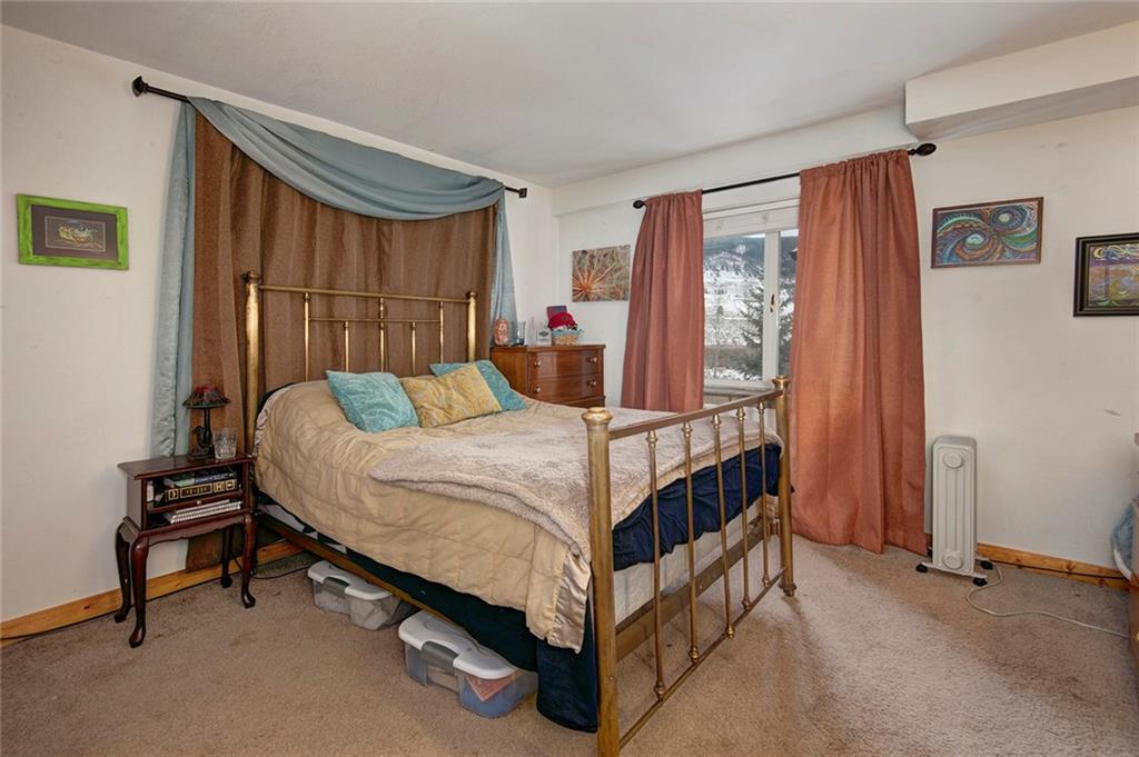76 Lakeside Drive Dillon, CO 80435 - Photo 20 of 23 a bed sitting in a room next to a window