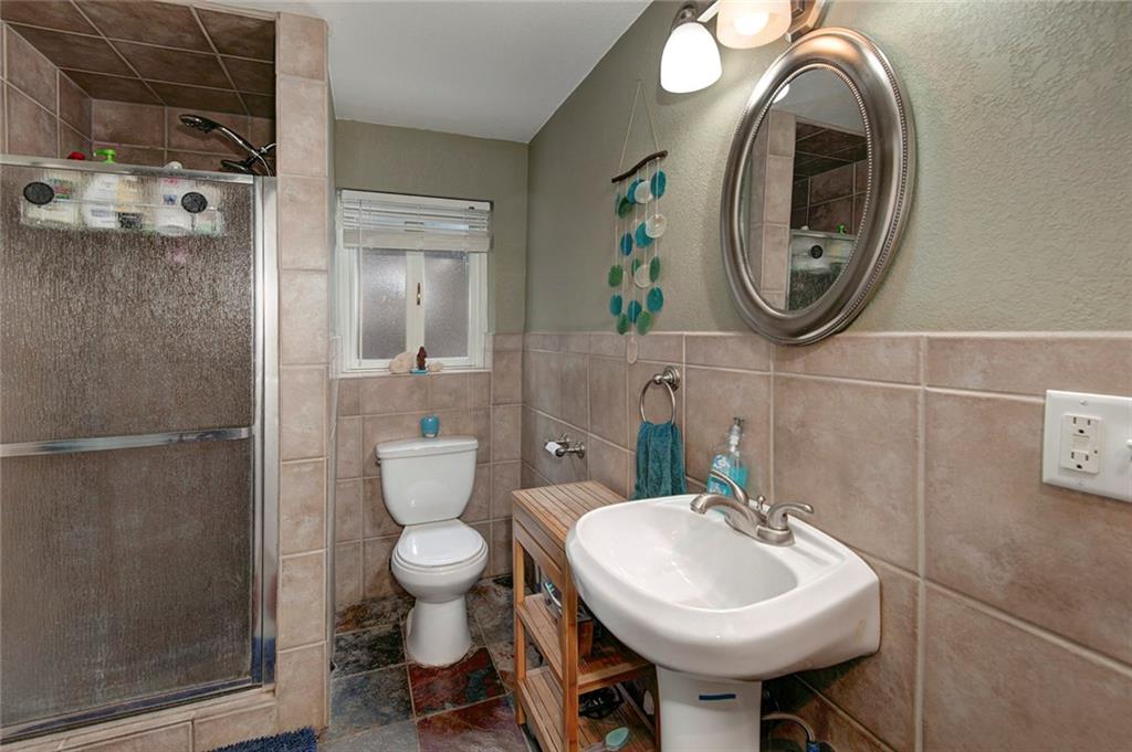 76 Lakeside Drive Dillon, CO 80435 - Photo 22 of 23 a bathroom with a toilet sink and mirror