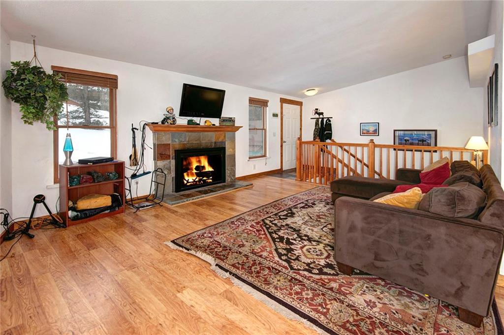 76 Lakeside Drive Dillon, CO 80435 - Photo 4 of 23 a living room with furniture and a fireplace