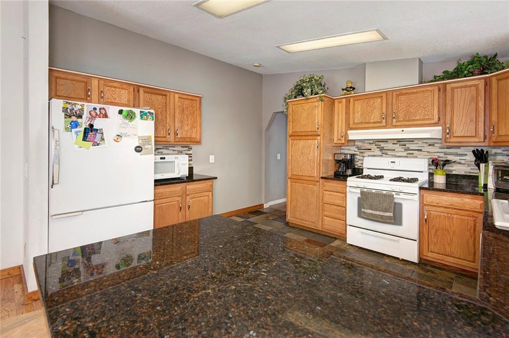 76 Lakeside Drive Dillon, CO 80435 - Photo 10 of 23 a kitchen with a white cabinets and white appliances