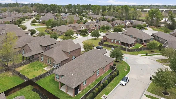 an aerial view of lake houses with outdoor space