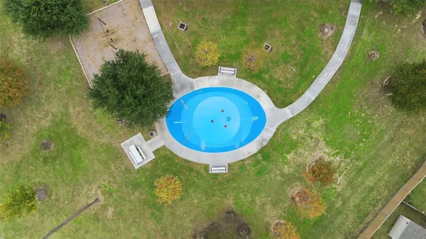 a view of a swimming pool in a backyard