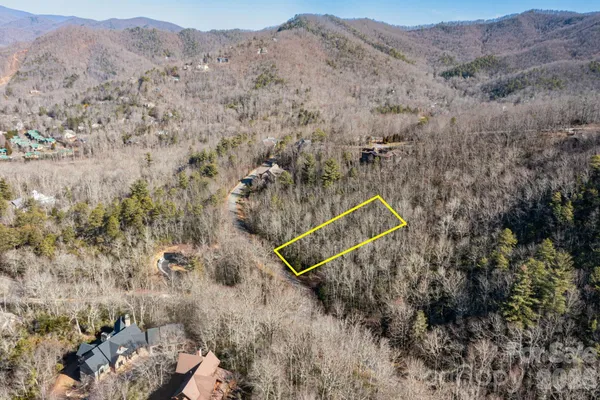a aerial view of a house with a backyard space