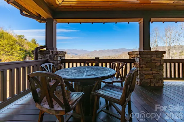 a view of a chairs and table on the deck