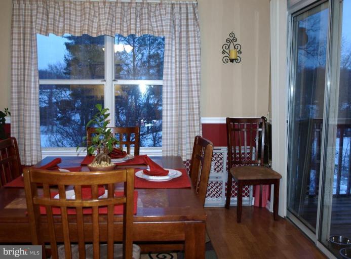 6 Fallen Tree Court, Unit 6E Halethorpe, MD 21227 - Photo 13 of 13 Dining with entrance to deck
