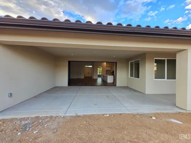 a view of a house with a garage and a fireplace