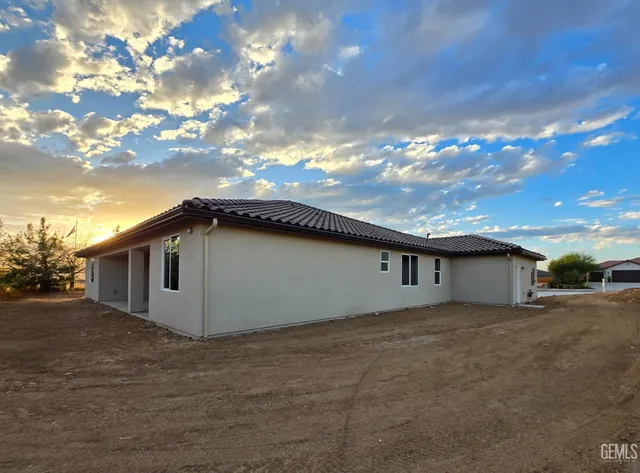 a view of backyard of a house