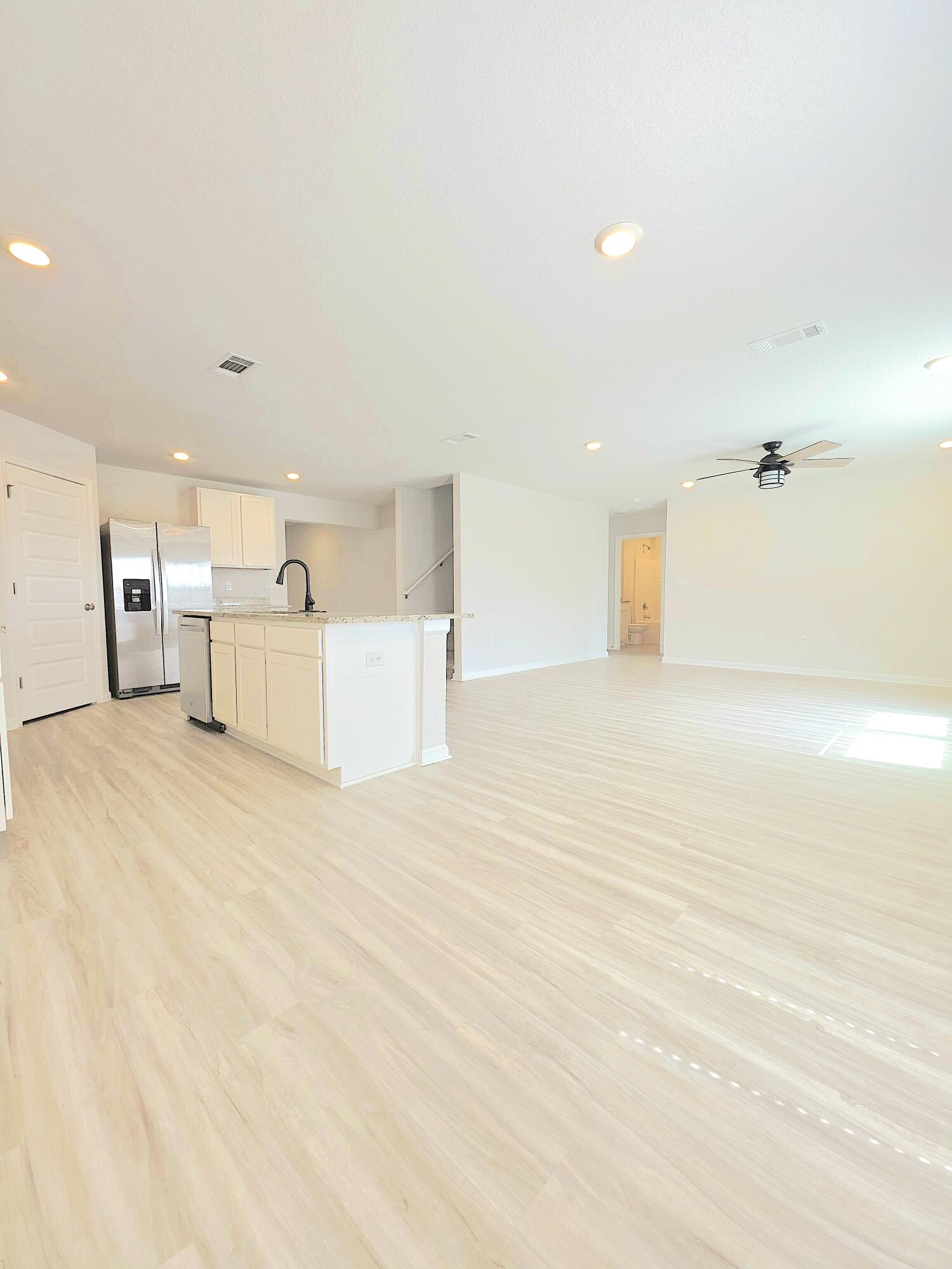 805 Otto Loop Crestview, FL 32539 - Photo 12 of 32 a view of a kitchen with a dishwasher and cabinets