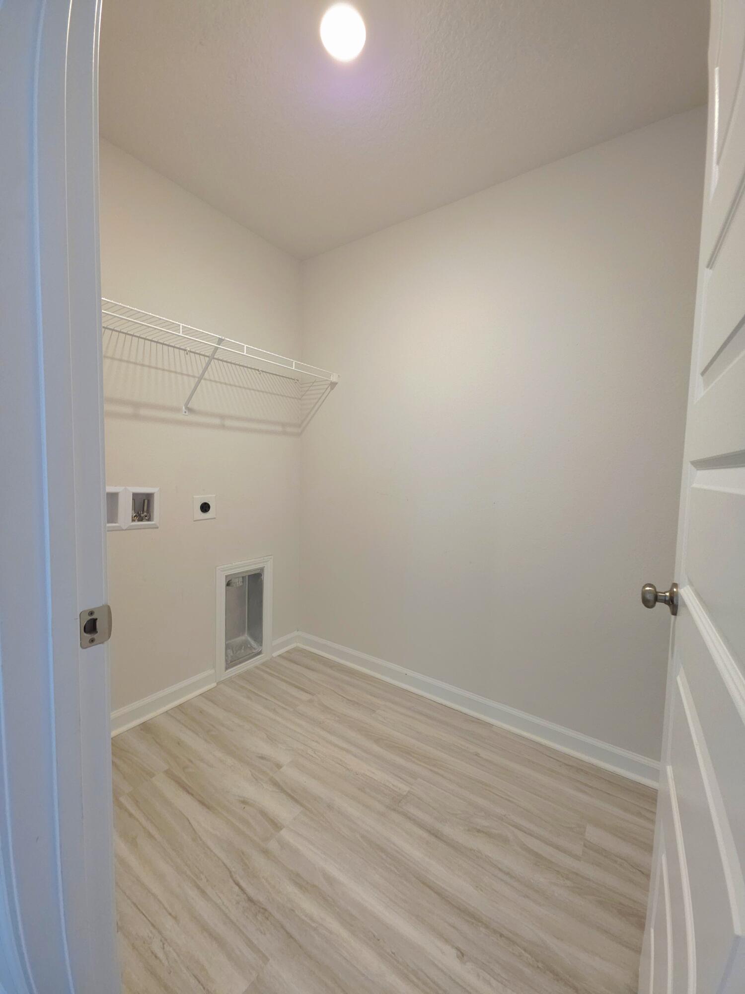 805 Otto Loop Crestview, FL 32539 - Photo 19 of 32 a view of a room with wooden floor