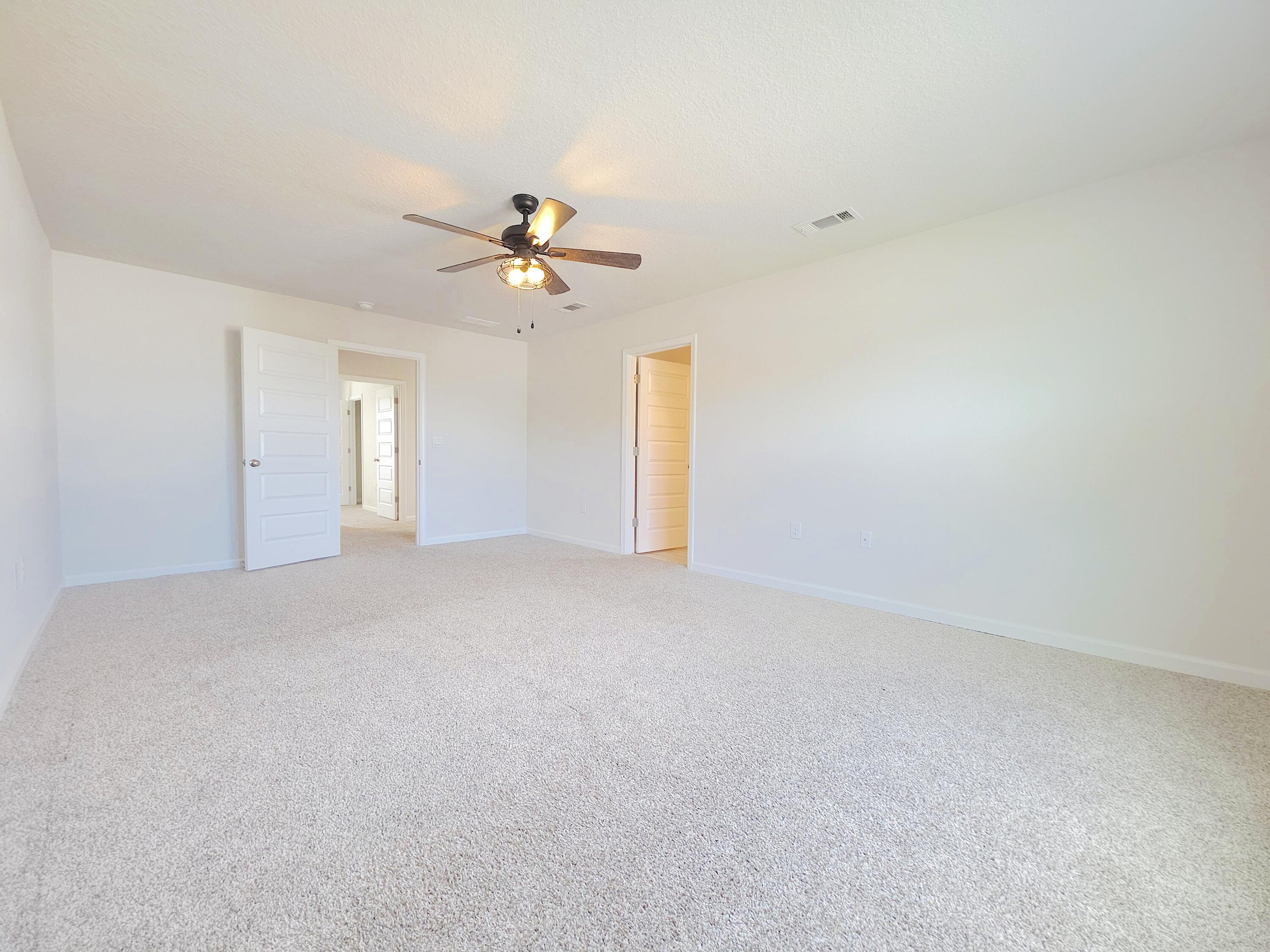 805 Otto Loop Crestview, FL 32539 - Photo 21 of 32 a view of a big room with carpet