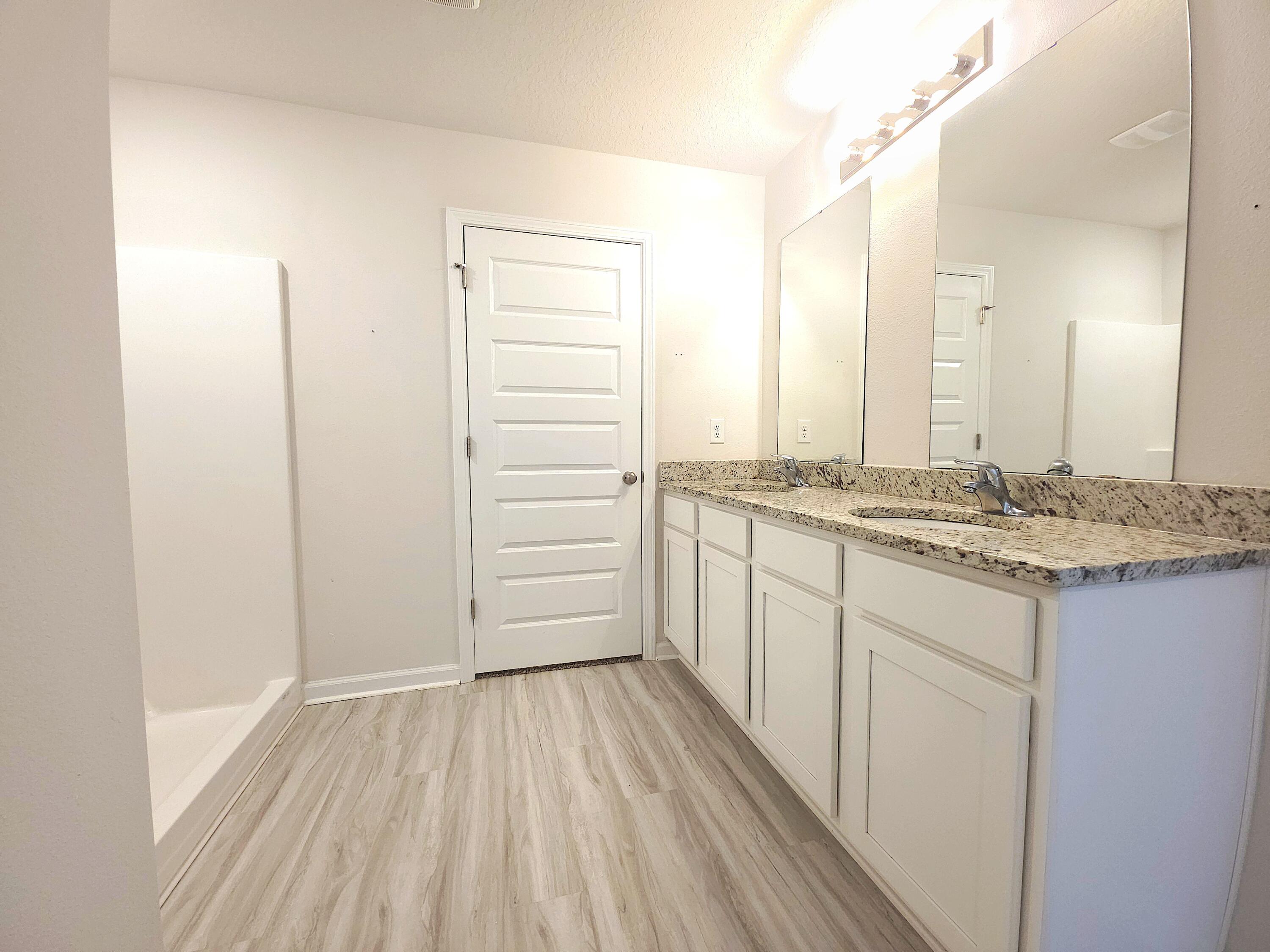 805 Otto Loop Crestview, FL 32539 - Photo 24 of 32 a bathroom with a granite countertop sink and a mirror