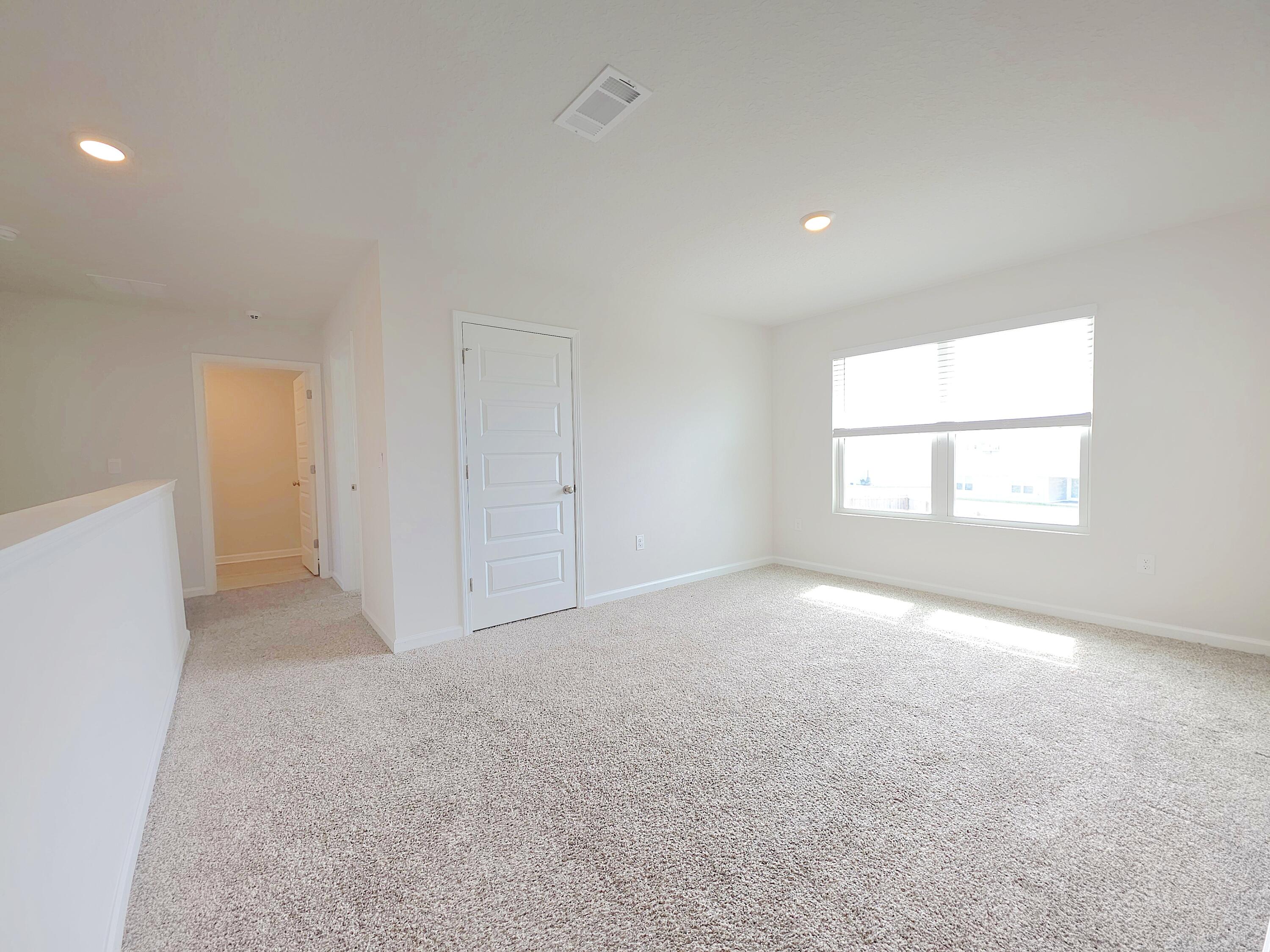 805 Otto Loop Crestview, FL 32539 - Photo 26 of 32 an empty room with a windows and closet