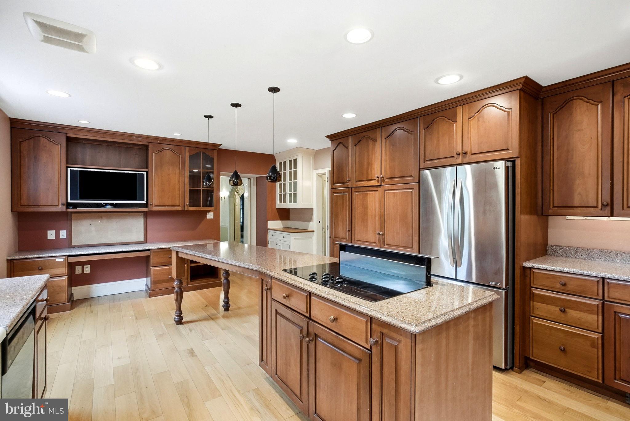 419 Riverview Road Swarthmore, PA 19081 - Photo 18 of 70 a kitchen with stainless steel appliances a stove and a refrigerator