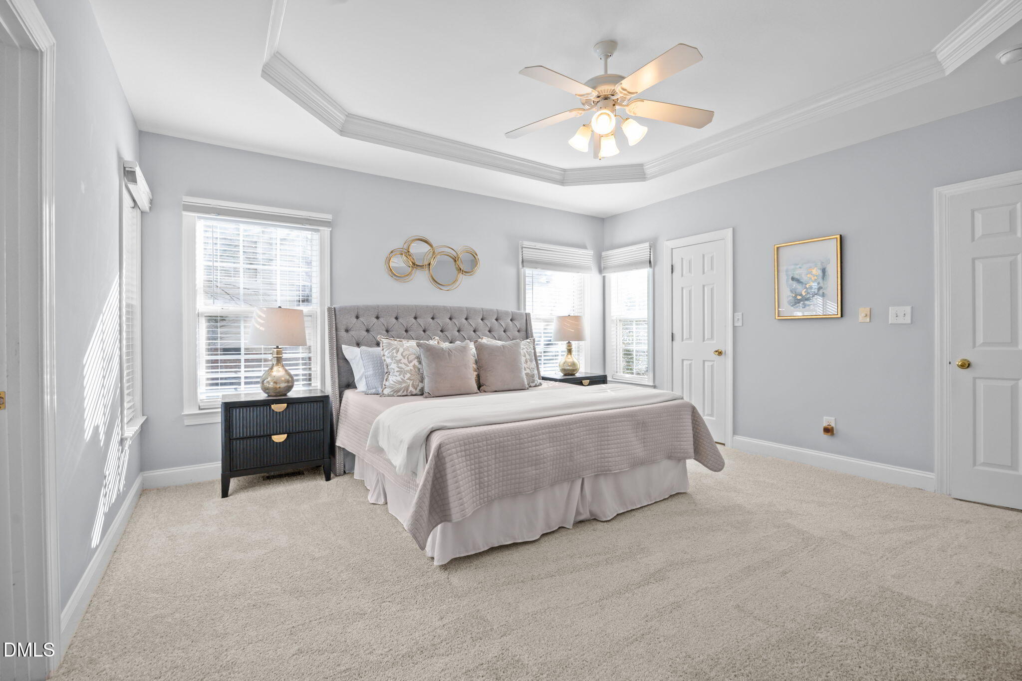 450 Seastone Street Raleigh, NC 27603 - Photo 14 of 47 a bedroom with a bed and a chandelier