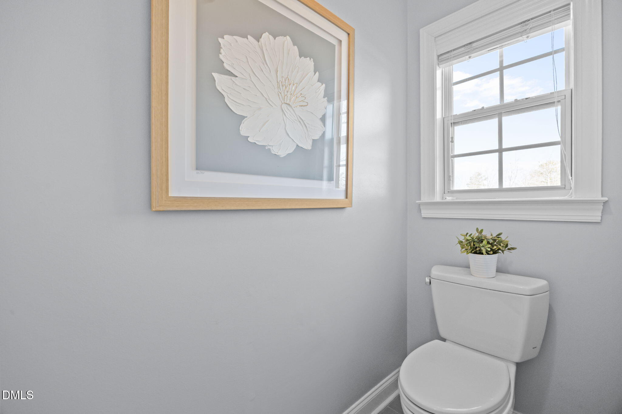 450 Seastone Street Raleigh, NC 27603 - Photo 17 of 47 a white toilet sitting next to a window