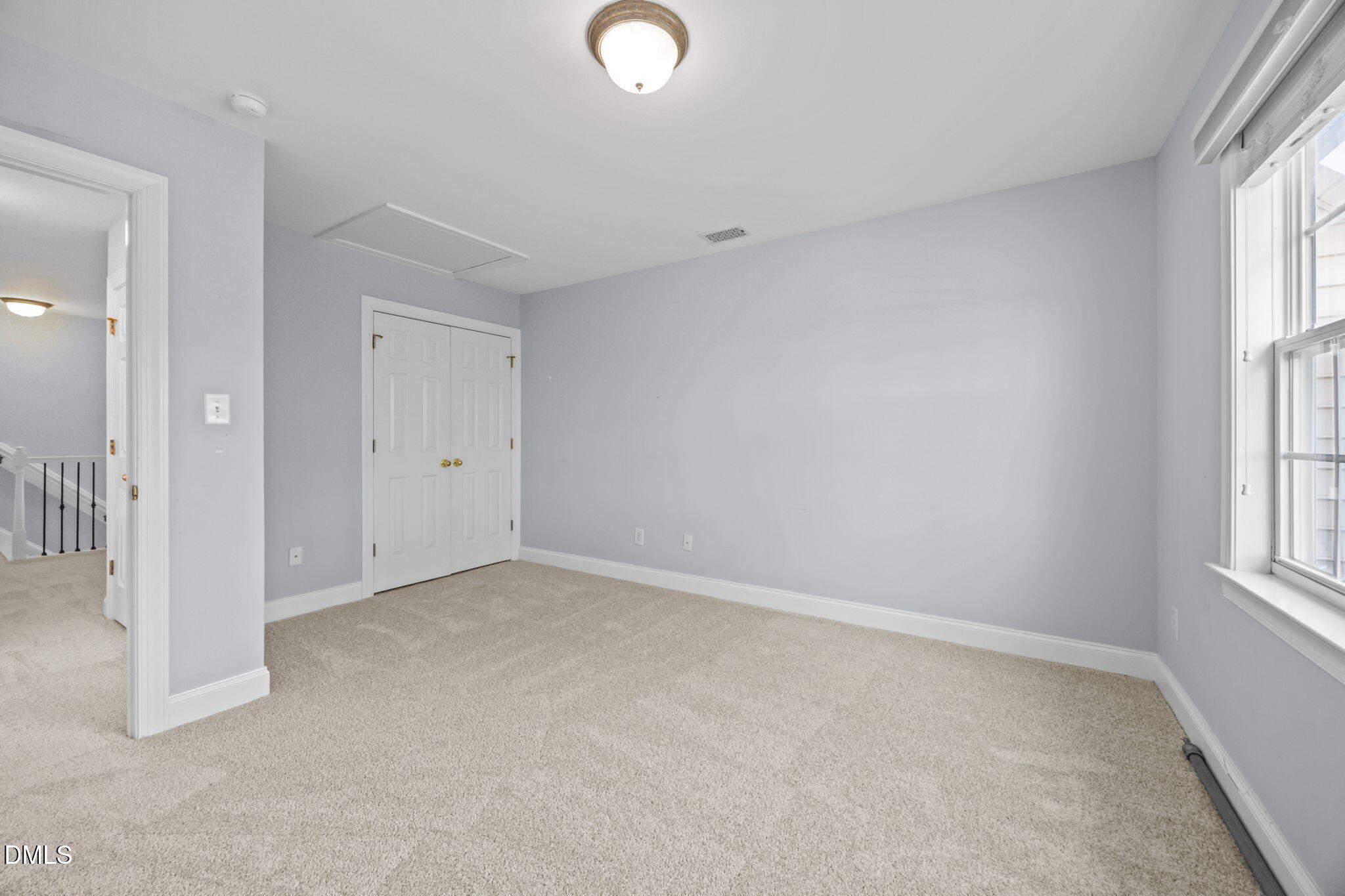 450 Seastone Street Raleigh, NC 27603 - Photo 21 of 47 an empty room with windows and closet