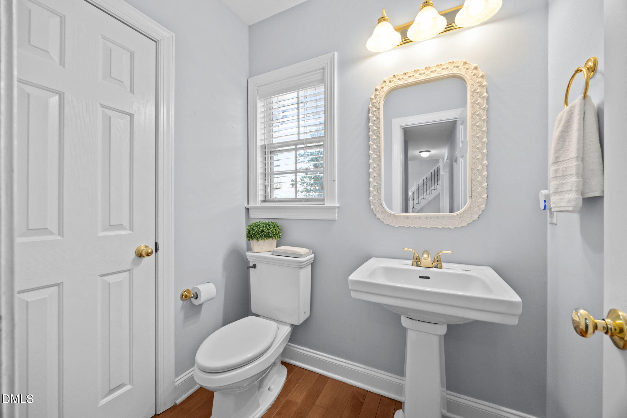 450 Seastone Street Raleigh, NC 27603 - Photo 25 of 47 a bathroom with a sink toilet and mirror