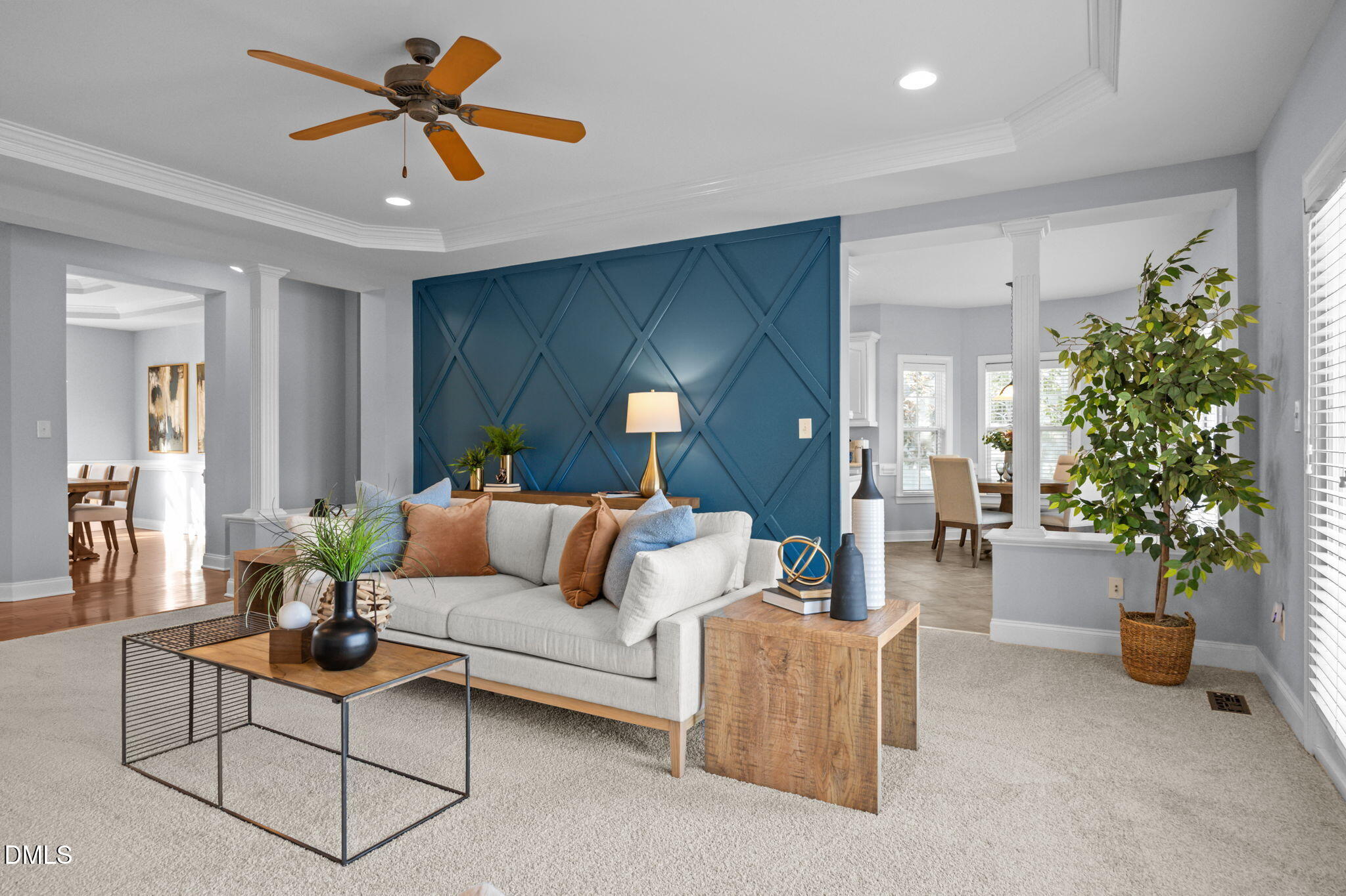 450 Seastone Street Raleigh, NC 27603 - Photo 3 of 47 a living room with furniture potted plant and a chandelier