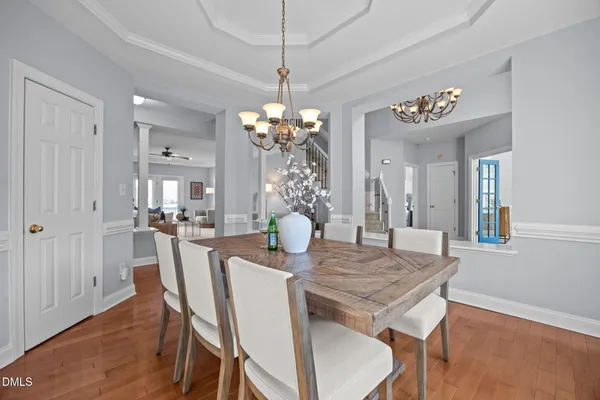 a view of a dining room with furniture and wooden floor