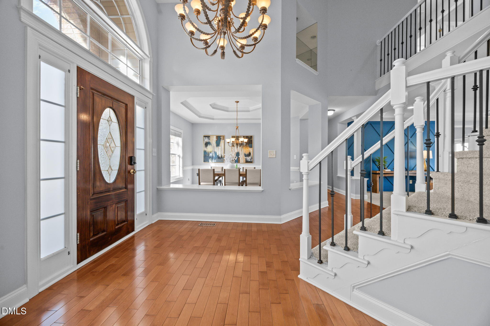 450 Seastone Street Raleigh, NC 27603 - Photo 10 of 47 a view of entryway and hall with wooden floor