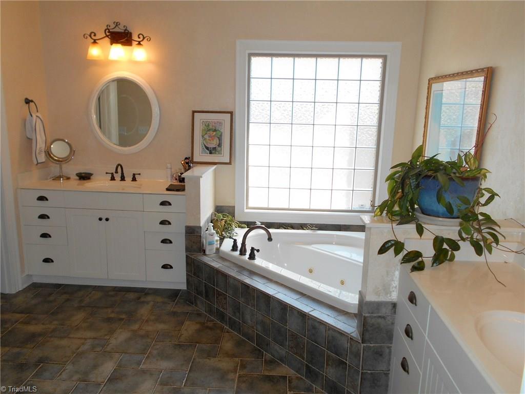 5044 Bennington Way High Point, NC 27262 - Photo 15 of 28 Spa like master bath with separate vanities & jetted tub