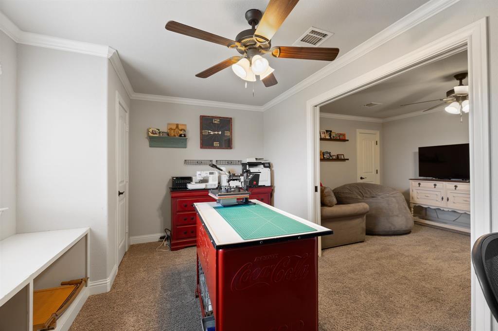 2103 Cash Point Court Granbury, TX 76049 - Photo 29 of 38 a living room with furniture and a flat screen tv