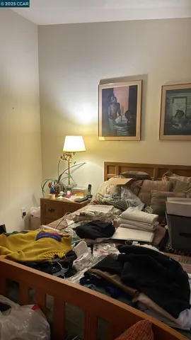 a view of a closet with wooden floor