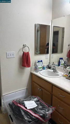 a bed sitting in a room next to a window