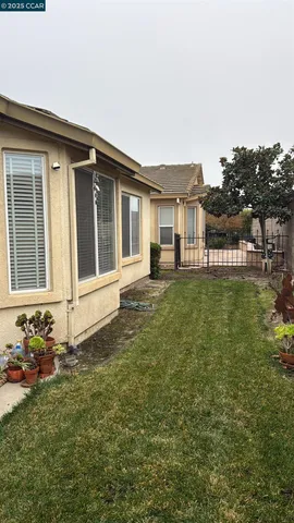a backyard of a house with lots of green space