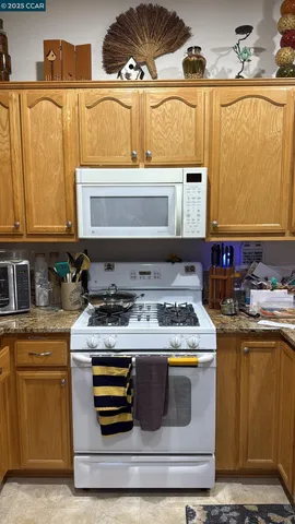 a kitchen with a stove and a sink