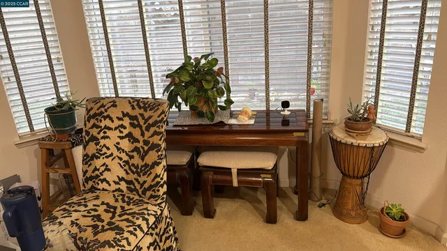 a room with a table and chairs