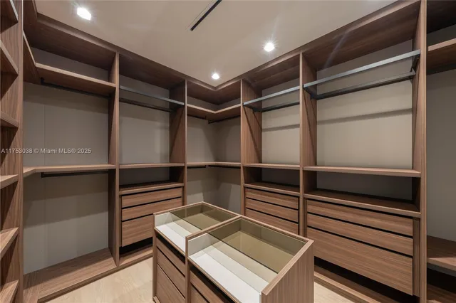 a view of an empty walk in closet