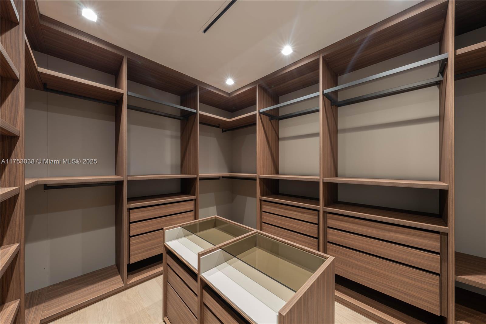 215 Shore Drive South Miami, FL 33133 - Photo 17 of 26 a view of an empty walk in closet