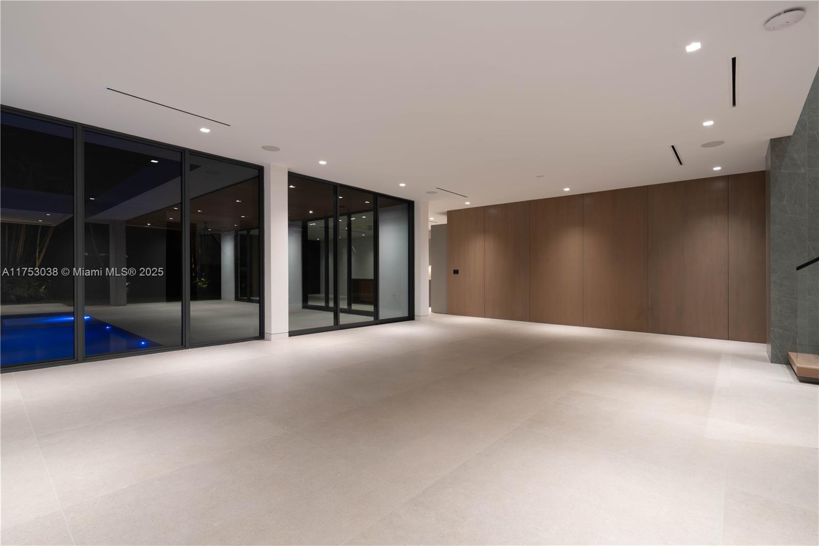 215 Shore Drive South Miami, FL 33133 - Photo 20 of 26 a view of an empty room with glass door