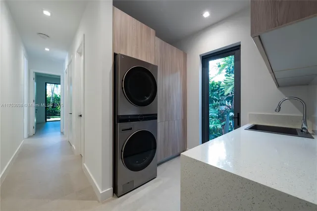 a view of a hallway with washer and dryer