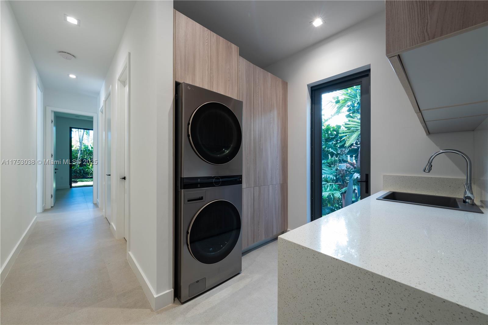 215 Shore Drive South Miami, FL 33133 - Photo 26 of 26 a view of a hallway with washer and dryer