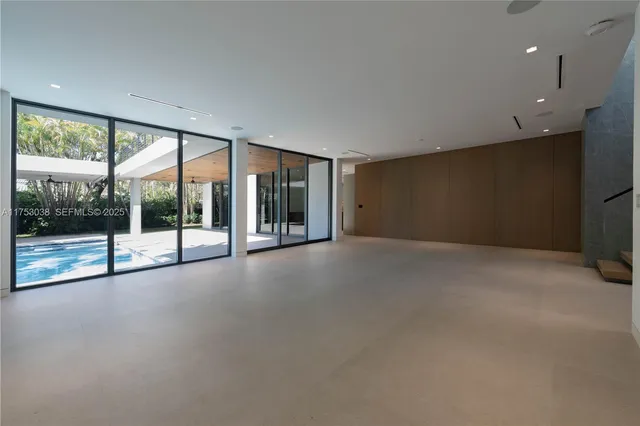 a view of an empty room with a sliding door