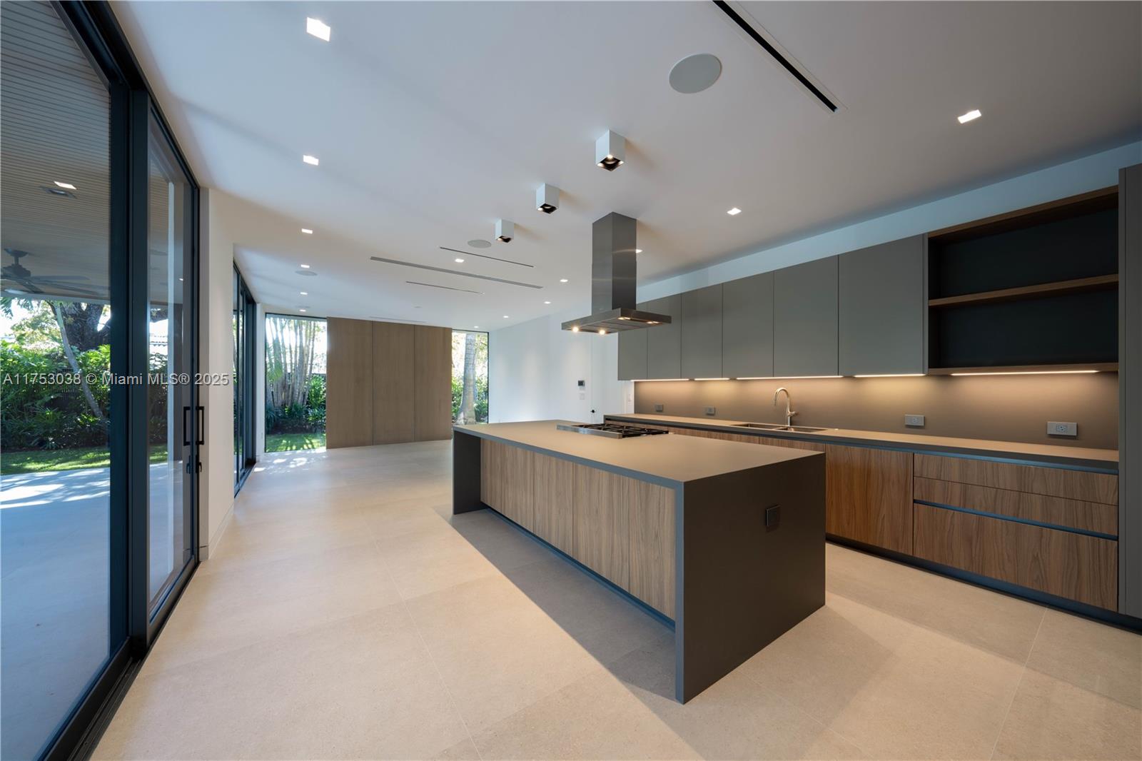 215 Shore Drive South Miami, FL 33133 - Photo 5 of 26 a kitchen with a stove and a sink