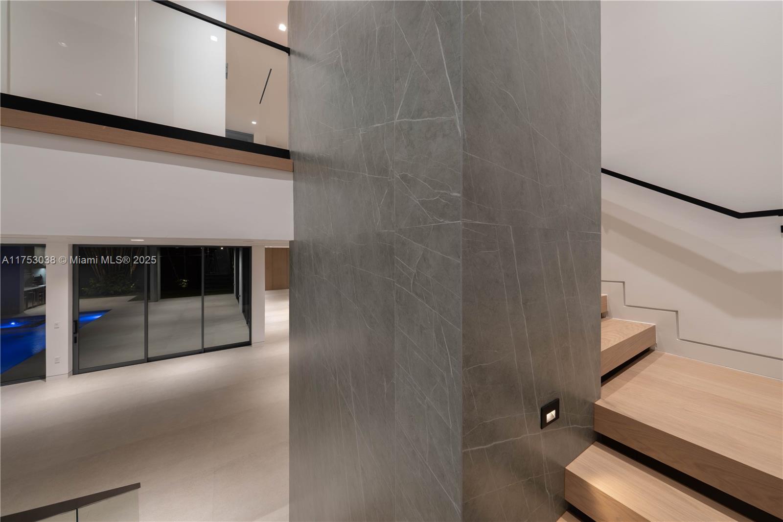 215 Shore Drive South Miami, FL 33133 - Photo 10 of 26 a view of a livingroom with an empty space and a fireplace