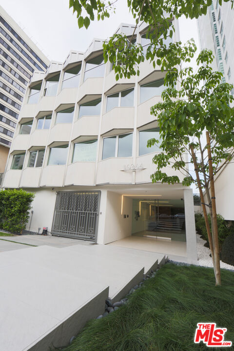 10366 Wilshire Boulevard, Unit 201 Los Angeles, CA 90024 - Photo 1 of 7 a view of house with yard