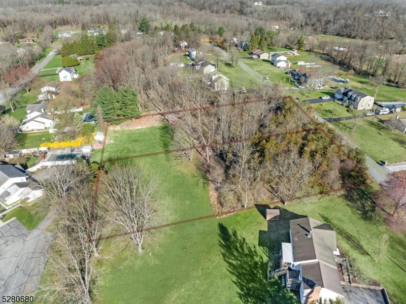 a aerial view of a houses with yard