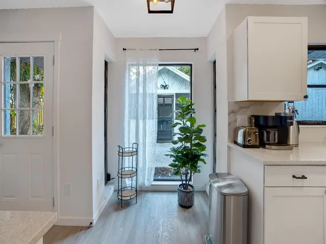 a view of entryway with wooden floor