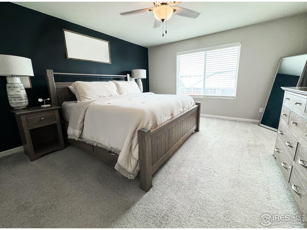 531 Ranchhand Drive Berthoud, CO 80513 - Photo 14 of 34 a bed room with a bed and a tv