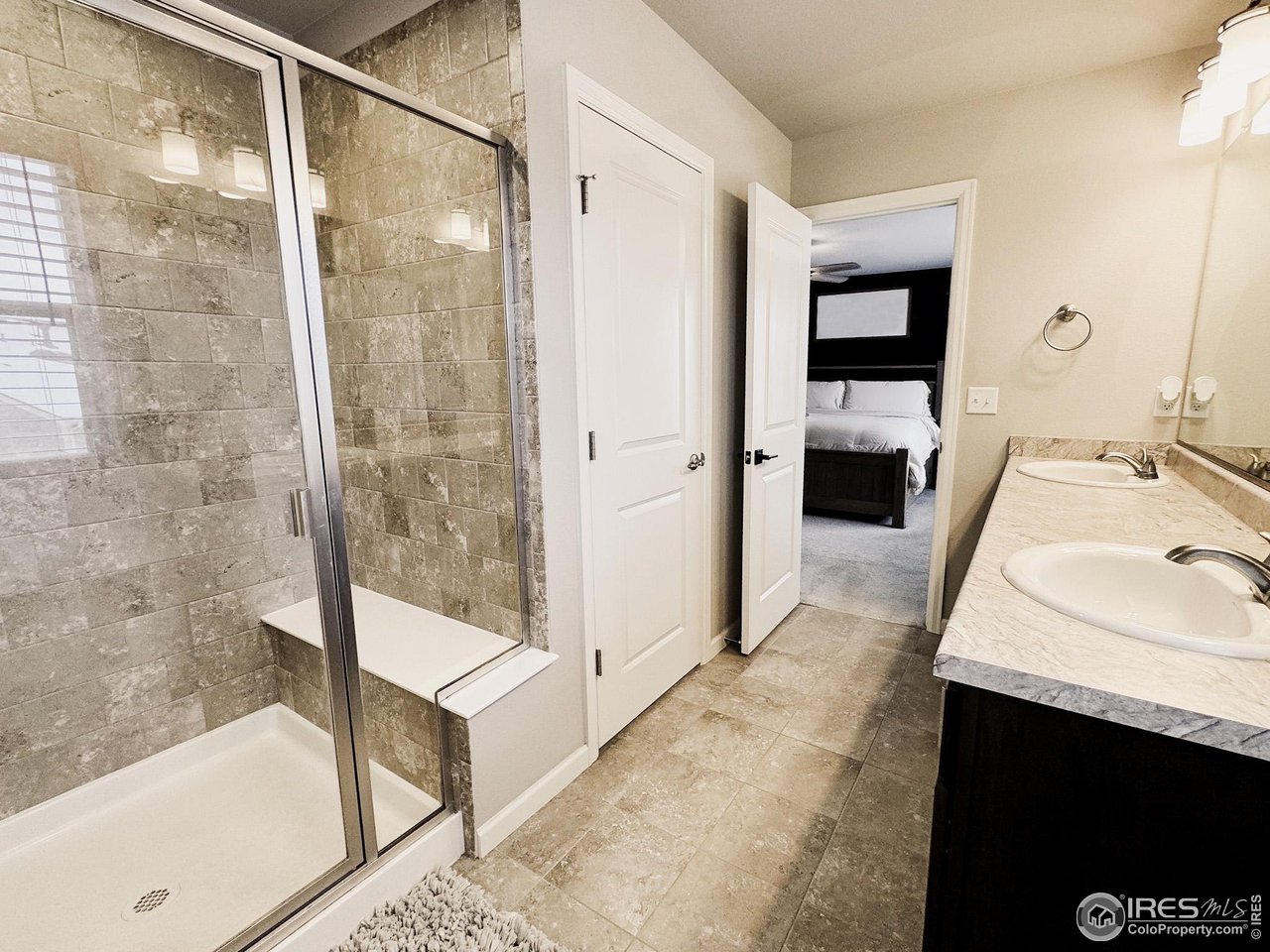 531 Ranchhand Drive Berthoud, CO 80513 - Photo 15 of 34 a bathroom with a sink a toilet and shower