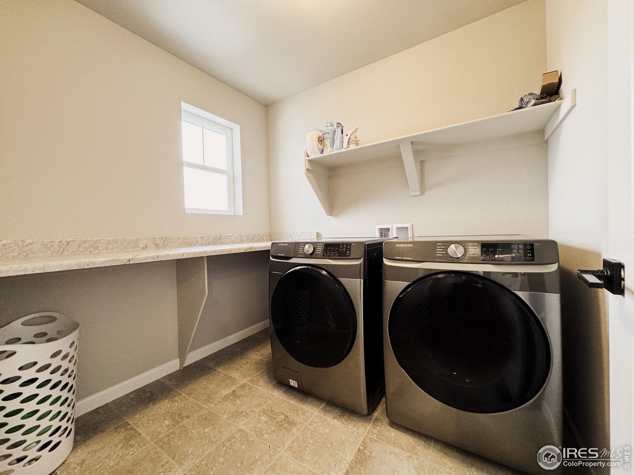 531 Ranchhand Drive Berthoud, CO 80513 - Photo 20 of 34 a utility room with sink dryer and washer