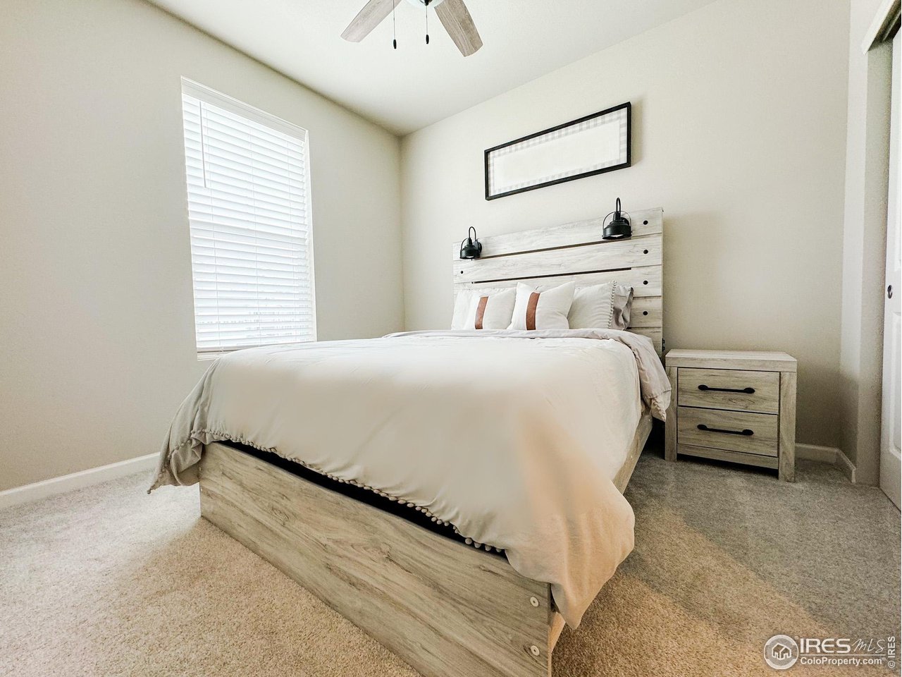 531 Ranchhand Drive Berthoud, CO 80513 - Photo 10 of 34 a bedroom with a bed and a dresser