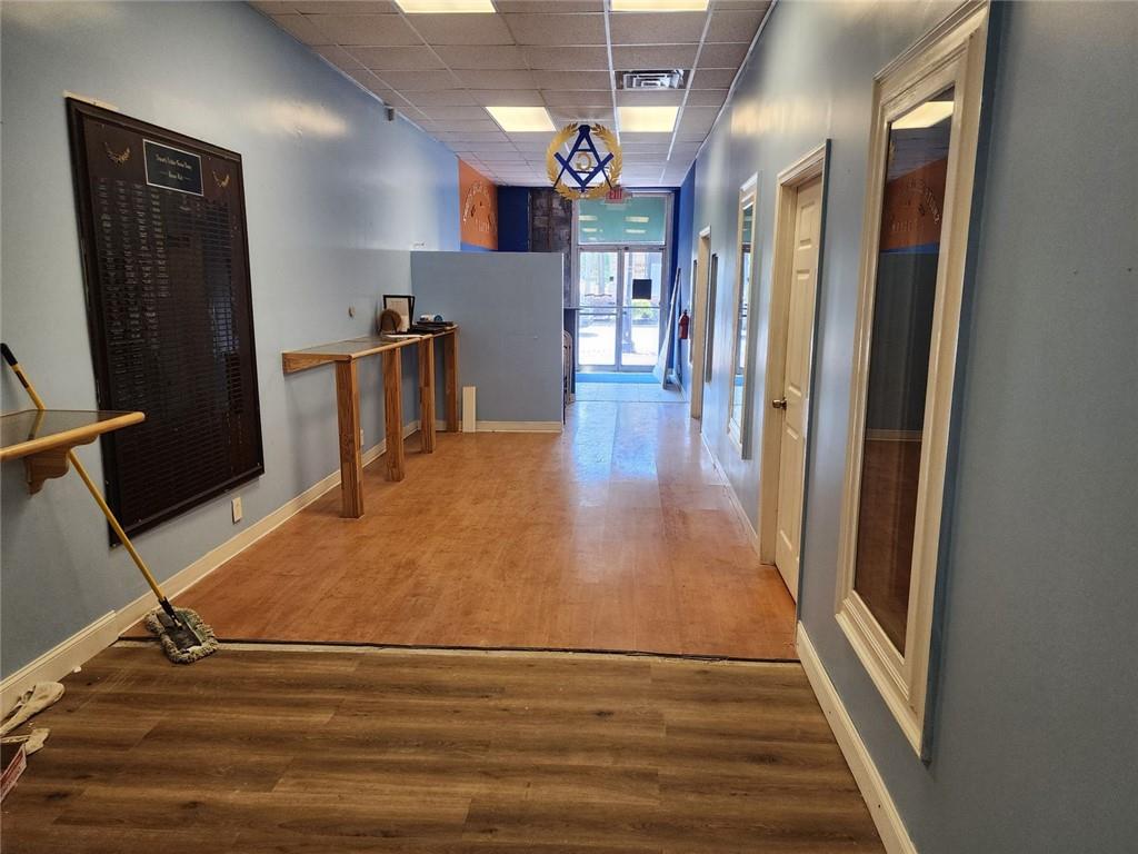 6958 Main Street Lithonia, GA 30058 - Photo 6 of 55 a view of a hallway with wooden floor