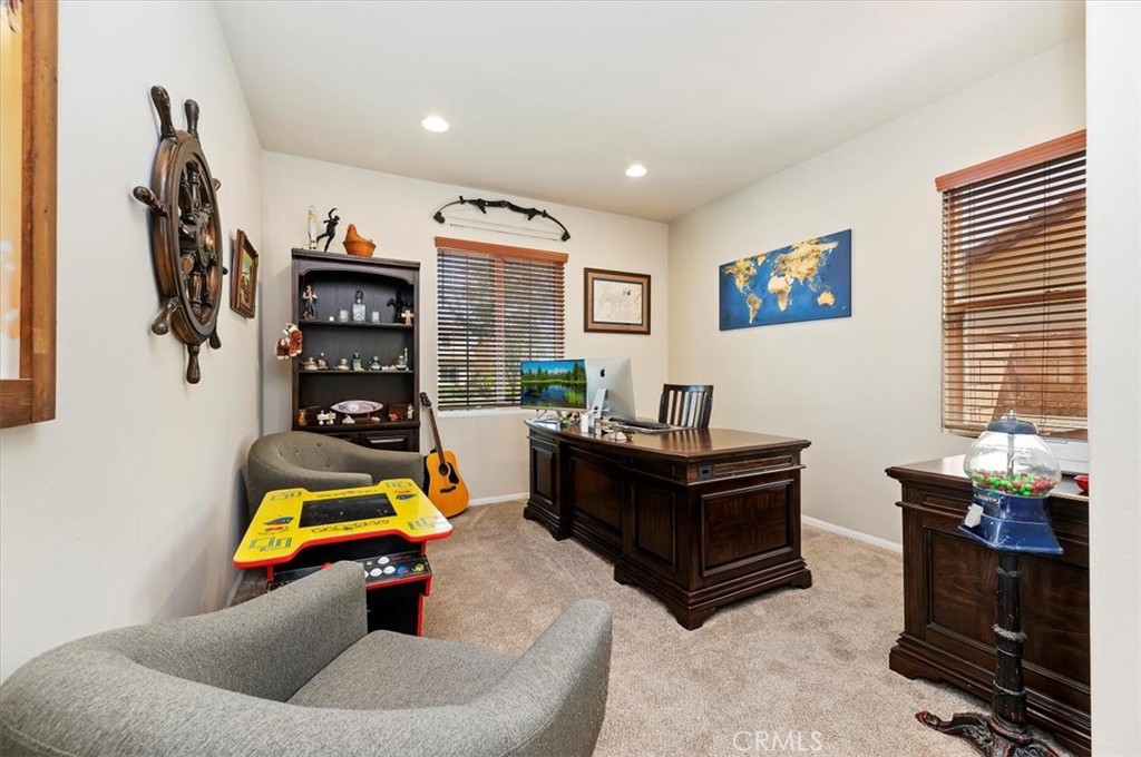 11745 Silver Birch Road Corona, CA 92883 - Photo 8 of 62 a living room with furniture and a gym equipment