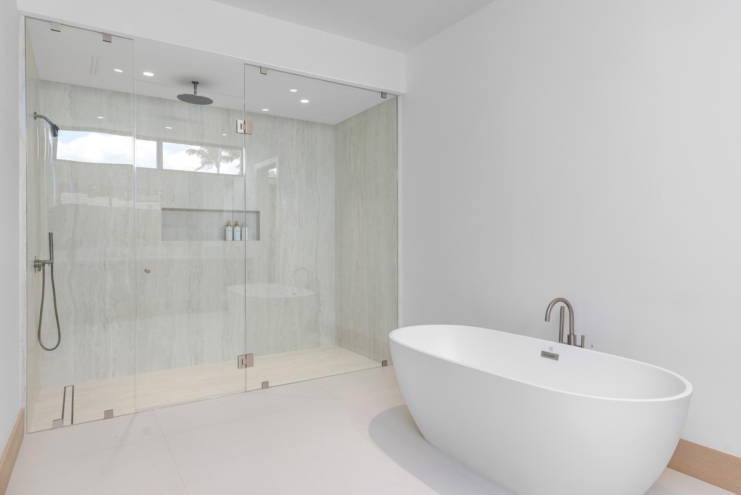 1351 Cocoanut Road Boca Raton, FL 33432 - Photo 84 of 101 a bathroom with a bathtub and shower